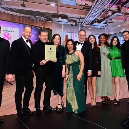 Group of people on stage accepting an award