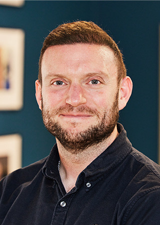 Headshot of Alex Jones at Peldon Rose