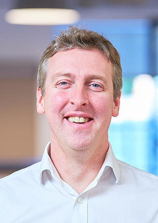 Peldon Rose Headshot of Dan Dawes.