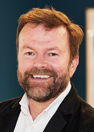 Head shot of Russell Glover Group Design Director at Peldon Rose